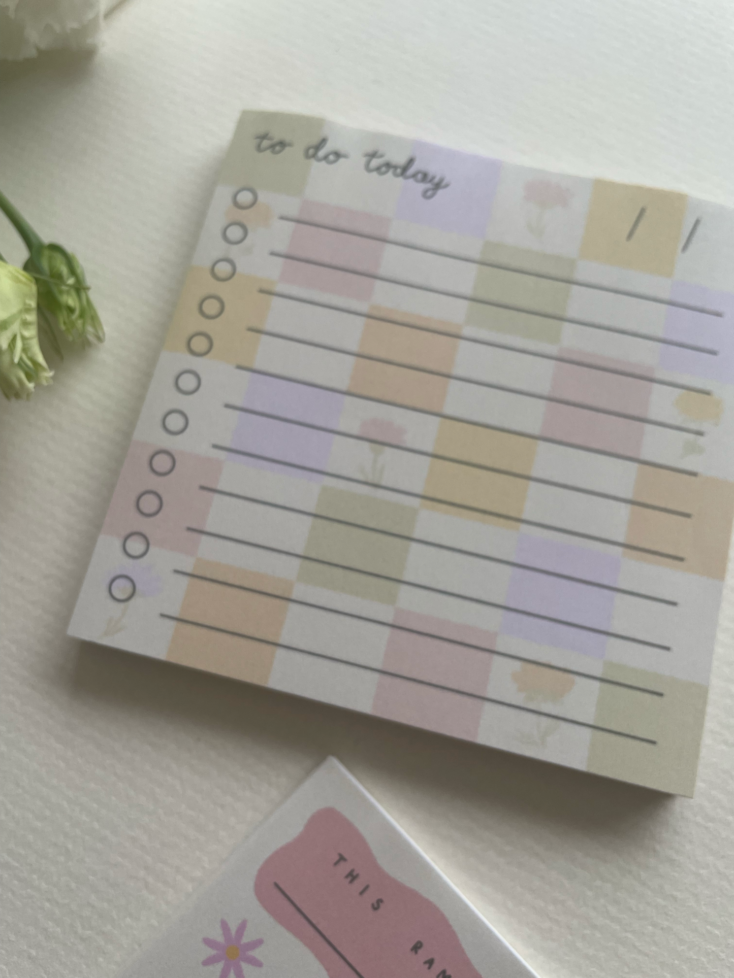 Notebook with a checkered design on a light surface