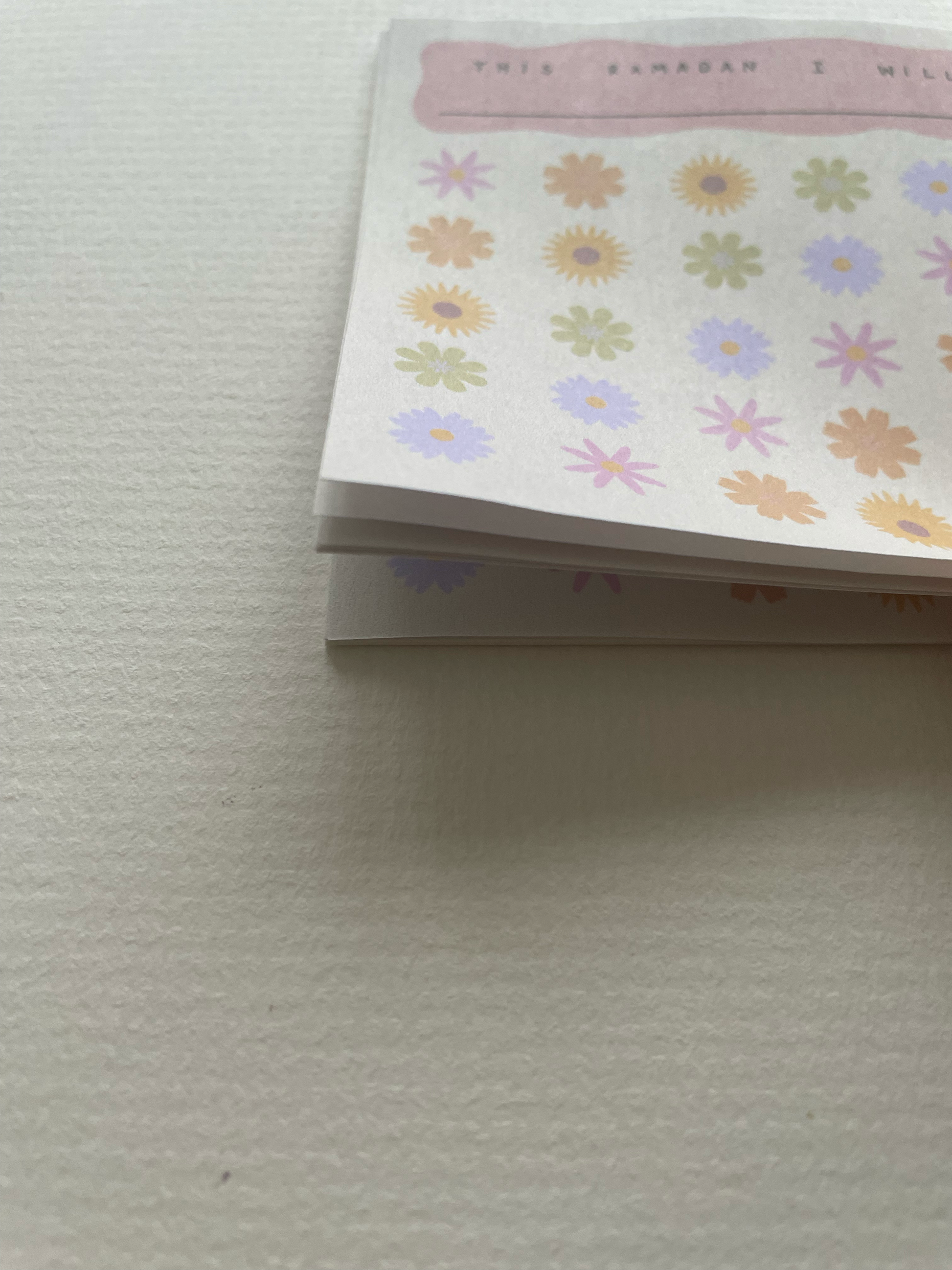 Notebook with floral pattern on a light gray background